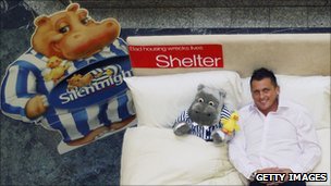 England cricketer Darren Gough posing on a bed in a promotion for Silentnight